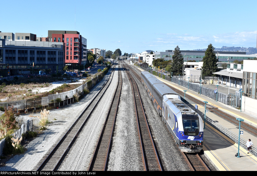 Caltrans owned Charger # 2105 pushes Amtrak Train # 536 out of Emeryville Station